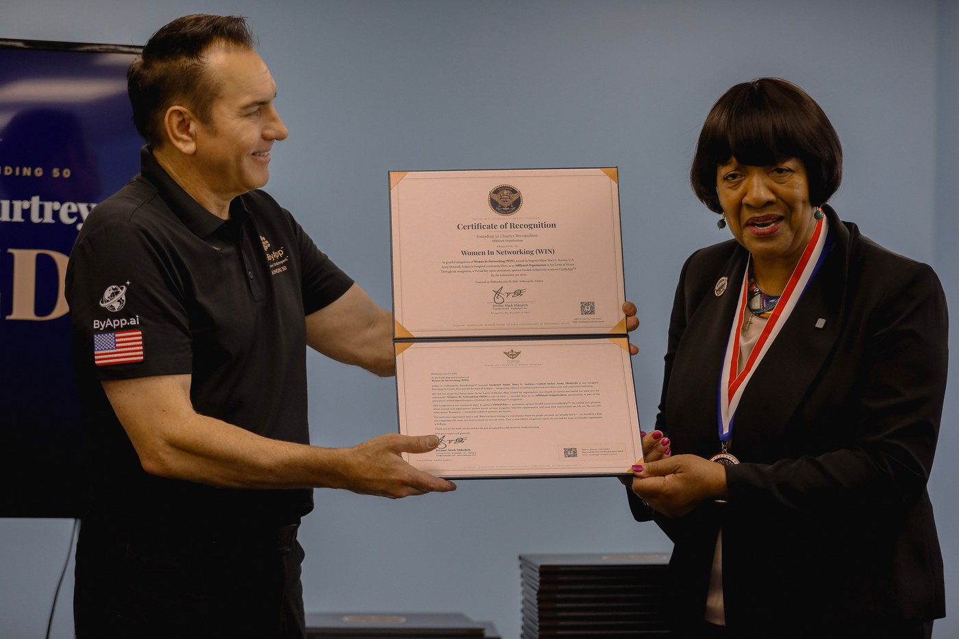 Jerome Mark Mikulich presents Women In Networking (WIN) its HeroByApp Recognition Certificate, Letter, and Virtual Key