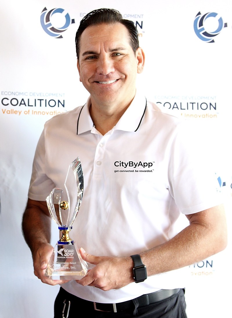Jerome Mark Mikulich accepts the SOAR Ovation Award for Innovation, presented to CityByApp